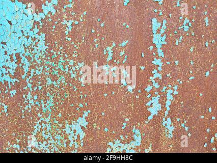 Multicolor background, rusty metal surface with cracking blue paint, weathered old texture Stock Photo