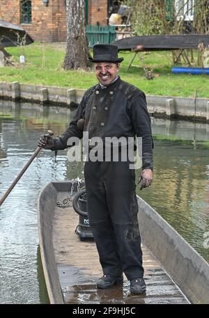 14 April 2021, Brandenburg, Lübbenau: The master chimney sweep Tino Winkler is standing in his barge on a river (waterway) in the Spreewald. Photo: Patrick Pleul/dpa-Zentralbild/ZB Stock Photo