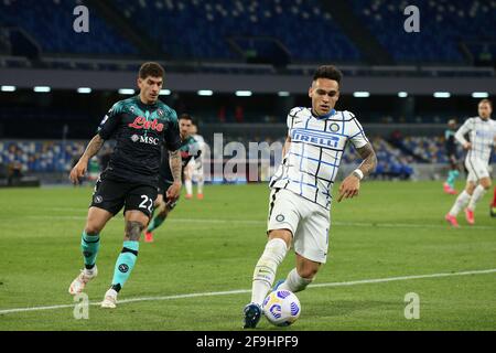 Naples, Italy. 18th Apr, 2021. Inter Milan's Argentinian forward Lautaro Martinez controls the ball next to Napoli's Italian defender Giovanni Di Lorenzo during the Serie A football match SSC Napoli vs FC Internazionale Milano. Napoli and Inter drew 1-1. Credit: Independent Photo Agency/Alamy Live News Stock Photo
