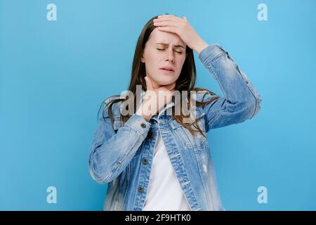 Disappointed millennial young female covers face with his hand, unhappy brunette woman feeling hopeless, suffering from stress and nervous tension Stock Photo
