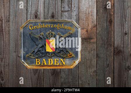 historical shield made of cast iron, Grand Duchy of Baden on rustic wooden wall Stock Photo