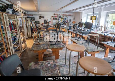 abandoned old vintage dark classroom in an old school in germany with left interior lost place. Stock Photo