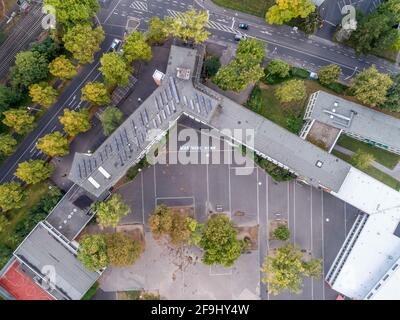 Friedrich Ebert Gymnasium Schoolyard text written saying what if in federal government district aerial panoramic view in Bonn city in Germany. Stock Photo