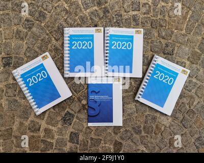 Munich, Bavaria, Germany. 19th Apr, 2021. Copies of the 2020 Verfassungsschutzbericht Bayern (2020 Bavarian Office for the Protection of the Constitution report). The Bavarian Verfassungsschutz (Secret Service, Office for the Protection of the Constitution) released the 2020 report detailing threats to the state of Bavaria and the country. Over the past year, conspiracy theorists, new age and wellness extremists, right-extremists, and various enemies of democracy have taken a leading role against the German state and society, with imagery such as the August 2020 storming of the Reichstag an Stock Photo