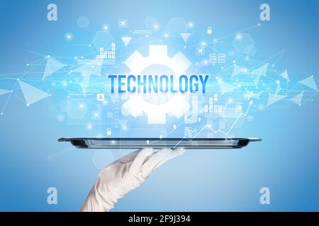 Waiter serving new technology concept Stock Photo