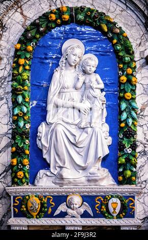 Renaissance tombstone with Madonna and child Stock Photo