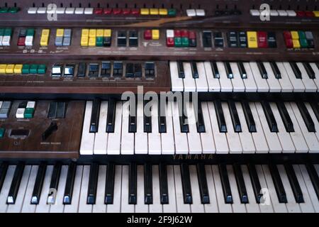 The Vintage Big Piano Keyboard. Many keys and buttons on a big old  church organ. Bangkok, Thailand in January 5, 2020. Stock Photo