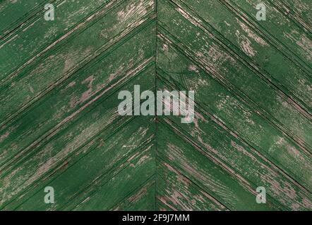 old weathered wood texture painted green color. herringbone pattern. Stock Photo