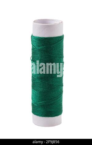 A new reel with green threads, isolated on a white background. Stock Photo