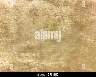 Texture decorative light beige plaster imitating old peeling wall. Obsolete cracked golden stone background with pattern. Structure of brown cement wa Stock Photo