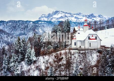 Hergiswald church high in the swiss Alps, Lucerne, Switzerland, is a famous religious pilgrimage place Stock Photo