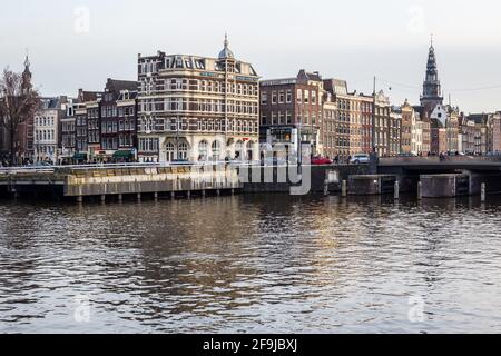 Amsterdam, Netherlands - March 11, 2017: View of Traditional Colorful Buildings iand Amsterdam Canal in the City Center Stock Photo