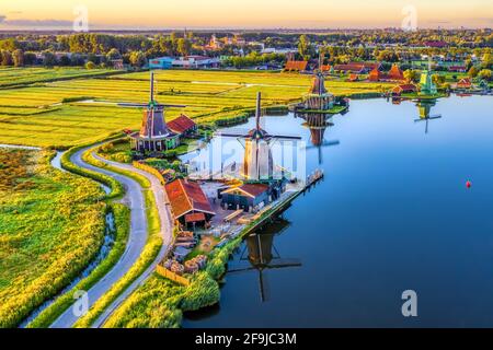 Zaanse Schans windmills park and fields landscape in Zaandam near Amsterdam, North Holland, Netherlands, aerial view in sunrise light Stock Photo