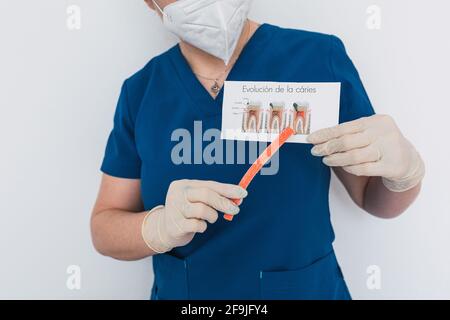 Dental doctor with a sugar gummy showing the process of tooth decay. Stock Photo