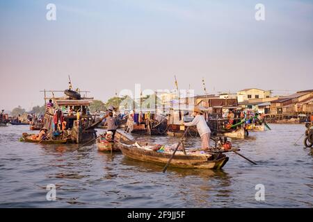 Can Tho, Vietnam - April 2, 2016: Houseboat on Cai Rang floating market in the Mekong Delta river. Life of Asian people on the water. Stock Photo