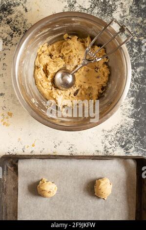 Making some cookies: cookie dough in the making, with a wisk and a spoon Stock Photo