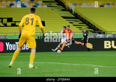 Non Exclusive: KYIV, UKRAINE - APRIL 17, 2021 - Defender Valeriy Bondar (R) of FC Shakhtar Donetsk and forward Artem Besedin of FC Dynamo Kyiv are see Stock Photo