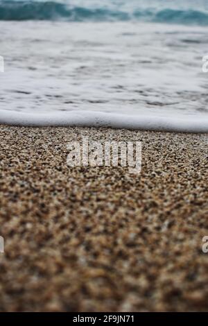 close up of waves breaking on the sand Stock Photo