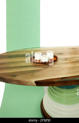 Luxurious wooden table with full hardwood and epoxy resin on a white background with a green ribbon. Stock Photo