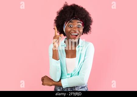 Excited African Woman Pointing Finger Up Having Idea, Pink Background Stock Photo