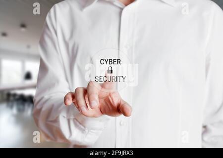Businessman presses on a virtual touch screen with the word cyber security with a lock icon. Business internet technology concept. Stock Photo