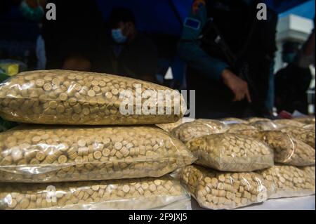 Military personnel seen guarding the evidence of methamphetamine and ecstasy as evidence of a case of drug trafficking at the Belawan Lantamal I Command Headquarters in North Sumatra, Indonesia on April 19, 2021. The Indonesian national navy has successfully arrested two smugglers of more than 100 kilogerams of amphetamine (crystal methamphetamine and ecstasy) drugs that are suspected of being carried from Malaysia - China in the waters of the Asahan River, North Sumatra, Indonesia on April 18, 2021. The disclosure was an intelligence collaboration and routine patrols, said the Commander of Ko Stock Photo