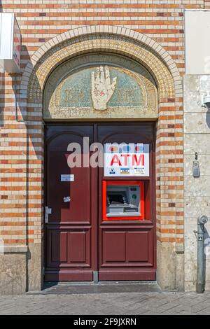 Amsterdam, Netherlands - May 14, 2018: Atm Built in Arch Door in Amsterdam, Holland. Stock Photo