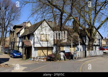 FOREST GATE, LONDON - 19TH APRIL 2021: Boarded up grade II listed public house The Spotted Dog in Newham. Once a hunting lodge for King Henry VIII. Stock Photo