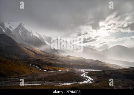 Landscape of beautiful landscape of Tian Shan Mountains Valley at sunset after strong rain in Almaty, Kazakhstan Stock Photo