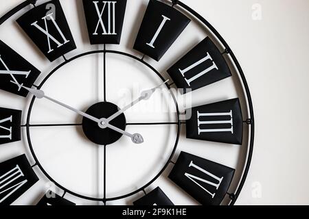 Close-up of black and white classic wall clock Stock Photo