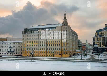 Moscow, Russia - January 17, 2021: View of the Balchug Kempinski Hotel on Balchug Street and Raushskaya Embankment in Moscow, near Kreml embankment on Stock Photo