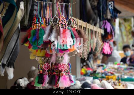 close up of colorful dream catcher shaped pendants on display in a craft store, tourism Stock Photo
