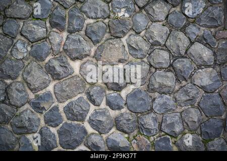 old dark paving stone background texture mural wall Stock Photo