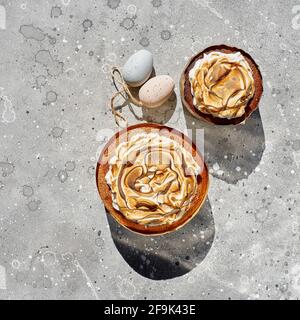 Flat lay composition with Easter cakes on a light stone background. Space for text. Easter Cake - Russian and Ukrainian Traditional Kulich Stock Photo