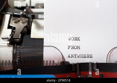 Work from anywhere phrase written with a typewriter. Stock Photo