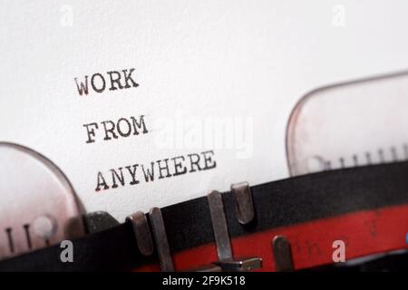 Work from anywhere phrase written with a typewriter. Stock Photo