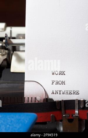Work from anywhere phrase written with a typewriter. Stock Photo