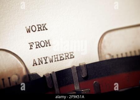 Work from anywhere phrase written with a typewriter. Stock Photo