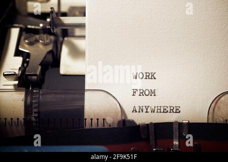 Work from anywhere phrase written with a typewriter. Stock Photo