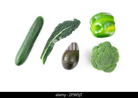 Layout made of green vegetables and fruits, kale, broccoli, bell pepper, cucumber, avocado Stock Photo