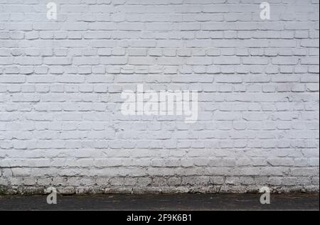 old and dirty white painted brick wall texture background with copy space Stock Photo