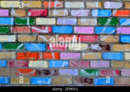 Rainbow colourful brick wall background. Colored wall stones Stock Photo