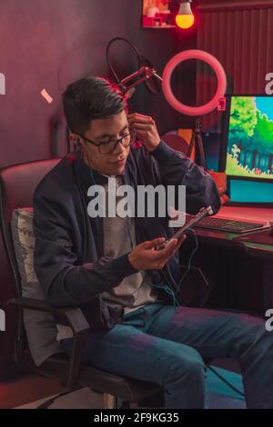 Young man passionate about video games. Practicing on your computer to be a professional gamer. Stock Photo