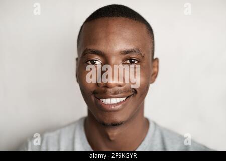 Young African man in a t-shirt smiling Stock Photo