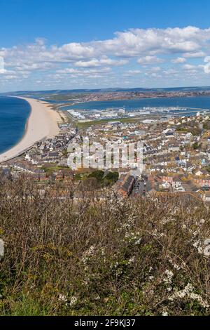 Looking down over Chesil Bank beach and Fortuneswell, Chiswell,  Isle of Portland from Portland Heights, Portland, Weymouth Dorset, UK in April Stock Photo
