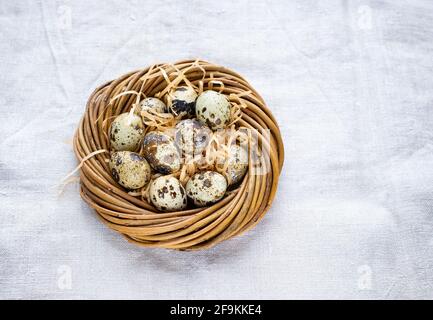 Happy Easter. Quail eggs in the nest, selective focus Stock Photo