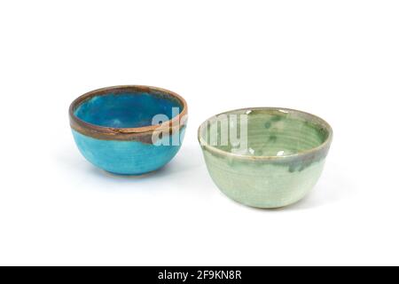 Blue and green hand made bowls isolated on white background Stock Photo