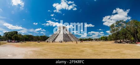 CHICHEN ITZA, MEXICO - FEB 26, 2016: Crowds of tourists visit the Kukulkan pyramid at the archeological site Chichen Itza. Stock Photo
