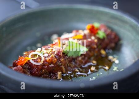 Beef steak tartar plate with chinese onion and ponzu japanese sauce Stock Photo