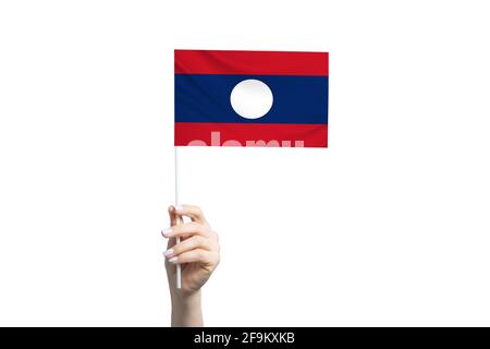 Beautiful female hand holding Laos flag, isolated on white background. Stock Photo
